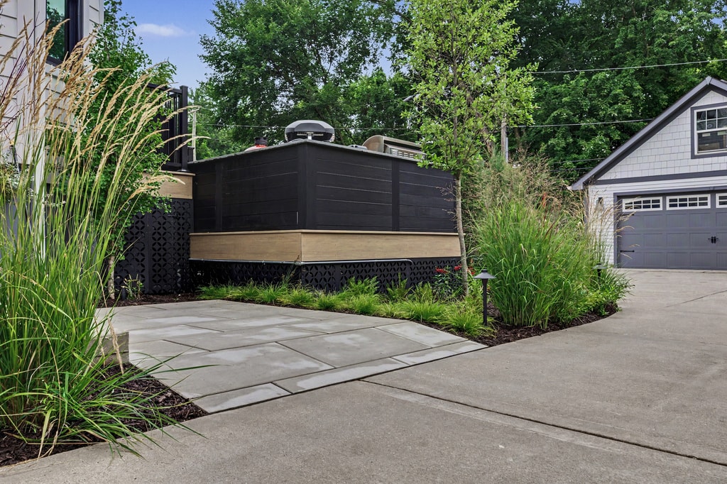 Lattice panels paired with stone and plantings in a Chicago backyard